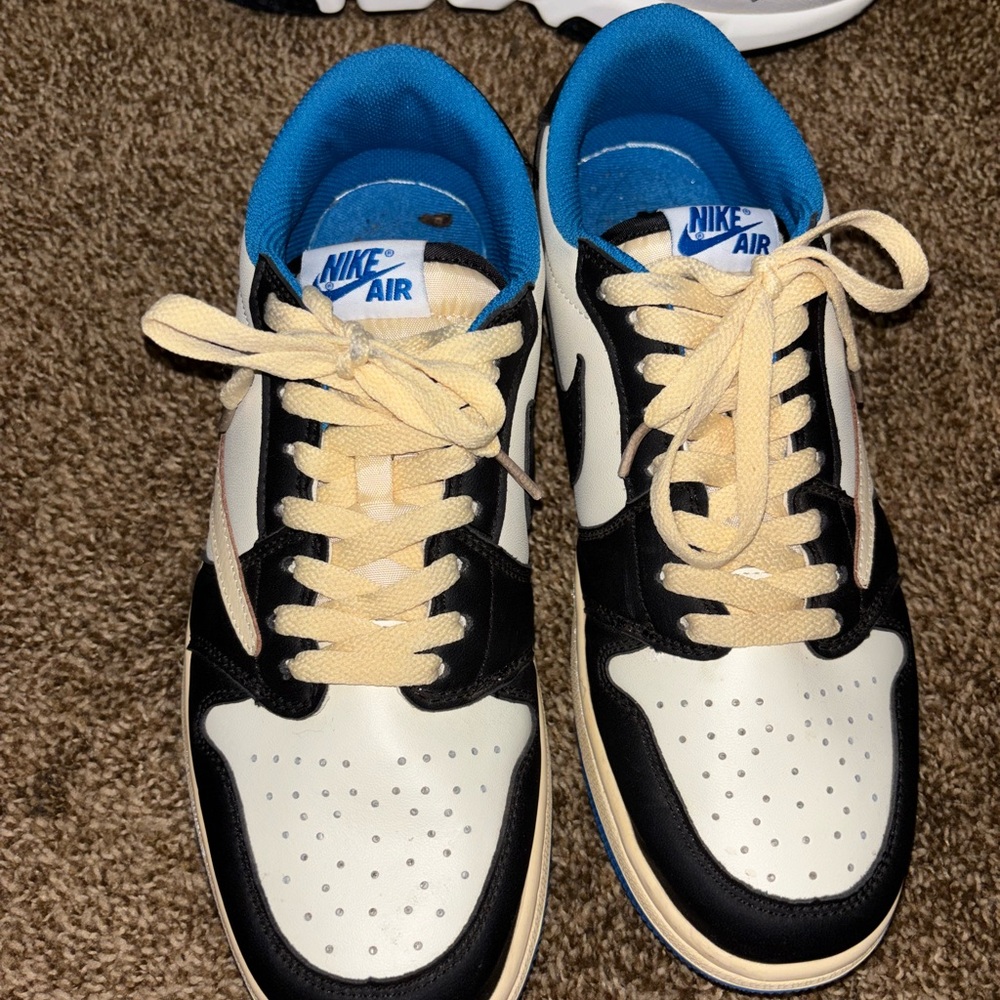 Nike Black, blue, and white Travis Scott’s X Air Jordan fragments